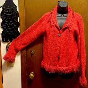 Rose Wind River cardigan with fringe around collar, bottom and cuffs